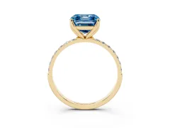 Fancy Blue Asscher Cut Diamond Solitaire Engagement Ring Set in Yellow gold with Round Pavé Band and Prong Setting