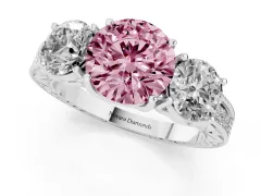 Fancy Pink Round Cut Diamond Three-Stone Engagement Ring Set in Platinum with Milgrain Pavé Band