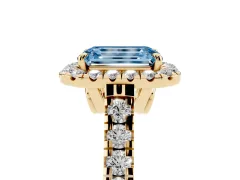 Fancy Blue Emerald Cut Diamond Halo Engagement Ring Set in Yellow gold with Pavé Band and Prong-Set Center