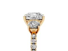 Cushion Cut Diamond Three-Stone Ring Set in Yellow gold with Pavé Band and Graduated Sides