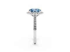 Fancy Blue Oval Cut Diamond Pavé Halo Engagement Ring Set in Silver with Pavé Band and Prong Setting