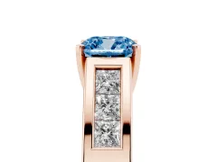 Fancy Blue Cushion Cut Diamond Solitaire Ring Set in Rose gold with Channel-Set Accent Stones and Prong Setting