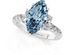 Fancy Blue Marquise Cut Diamond Three-Stone Pavé Ring Set in White gold with Prong Setting