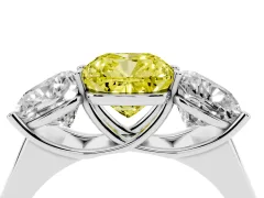Fancy Yellow Cushion Cut Diamond Three-Stone Ring Set in Platinum with Plain Polished Band