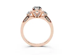 Fancy Black Pear Cut Diamond Three-Stone Ring Set in Rose gold with Pavé Band and Smaller Side Stones