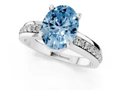Fancy Blue Oval Cut Diamond Solitaire Ring Set in White gold with Channel Set Band and Prong Setting