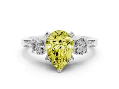 Fancy Yellow Pear Cut Diamond Three-Stone Ring Set in Platinum with Pavé Band and Smaller Side Stones