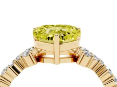 Fancy Yellow Heart Cut Diamond Ring Set in Yellow gold with Scattered Round Accents