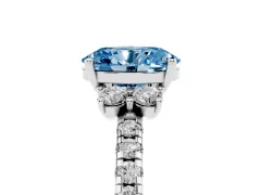 Fancy Blue Oval Cut Diamond Three-Stone Pavé Ring Set in White gold with Prong Setting