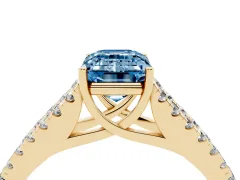 Fancy Blue Emerald Cut Diamond Split Shank Pavé Engagement Ring Set in Yellow gold with Prong-Held Center Stone