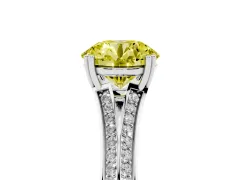 Fancy Yellow Round Cut Diamond Split Shank Pavé Engagement Ring Set in White gold with Prong-Set Center Stone