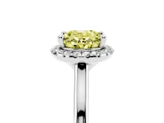 Fancy Yellow Oval Cut Diamond Halo Engagement Ring Set in White gold with Pavé Band and Rising Shoulders