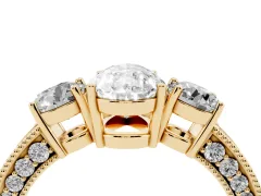 Pear Cut Diamond Three-Stone Ring Set in Yellow gold with Round Side Stones and Pavé Band