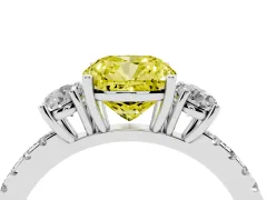 Fancy Yellow Cushion Cut Diamond Three-Stone Ring Set in Platinum with Pavé Band and Graduated Sides