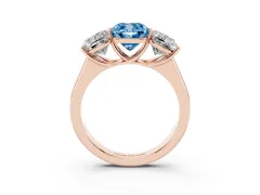Fancy Blue Cushion Cut Diamond Three-Stone Ring Set in Rose gold with Plain Polished Band