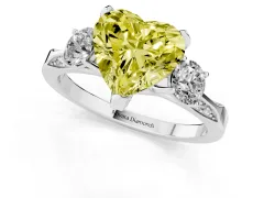 Fancy Yellow Heart Cut Diamond Three-Stone Ring Set in White gold with Pavé Band and Smaller Side Stones