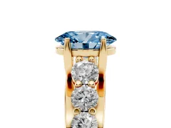 Fancy Blue Oval Cut Diamond Pavé Engagement Ring Set in Yellow gold with Prong Setting