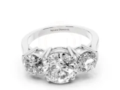 Round Cut Diamond Three-Stone Ring Set in Platinum with Round Accent Stones and Plain Band