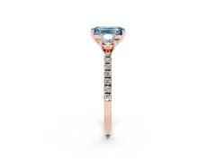 Fancy Blue Emerald Cut Diamond Three-Stone Ring Set in Rose gold with Pavé Band and Graduated Sides