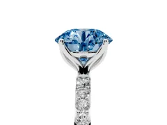 Fancy Blue Round Cut Diamond Solitaire Engagement Ring Set in Silver with Round Pavé Band and Prong Setting