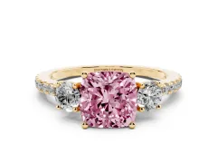 Fancy Pink Cushion Cut Diamond Three-Stone Ring Set in Yellow gold with Pavé Band and Graduated Sides