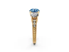 Fancy Blue Round Cut Diamond Three-Stone Engagement Ring Set in Yellow gold with Milgrain Pavé Band