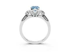Fancy Blue Pear Cut Diamond Three-Stone Ring Set in White gold with Pavé Band and Smaller Side Stones