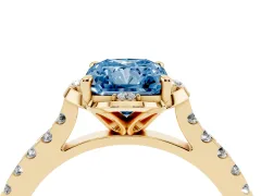 Fancy Blue Radiant Cut Diamond Solitaire Ring Set in Yellow gold with Pavé Band and Floral Prong Setting