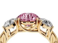 Fancy Pink Round Cut Diamond Three-Stone Engagement Ring Set in Yellow gold with Milgrain Pavé Band