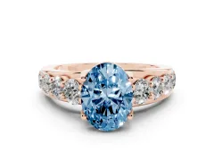 Fancy Blue Oval Cut Diamond Pavé Engagement Ring Set in Rose gold with Prong Setting