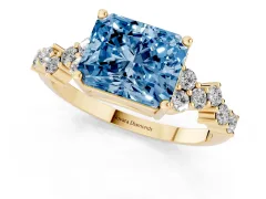 Fancy Blue Radiant Cut Diamond Ring Set in Yellow gold with Scattered Round Accents
