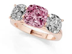 Fancy Pink Cushion Cut Diamond Three-Stone Ring Set in Rose gold with Plain Polished Band