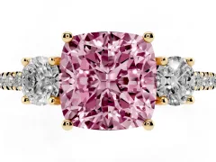 Fancy Pink Cushion Cut Diamond Three-Stone Ring Set in Yellow gold with Pavé Band and Graduated Sides