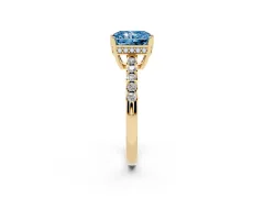 Fancy Blue Radiant Cut Diamond Solitaire Engagement Ring Set in Yellow gold with Pavé Band and Prong Setting