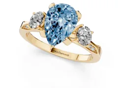 Fancy Blue Pear Cut Diamond Three-Stone Ring Set in Yellow gold with Pavé Band and Smaller Side Stones