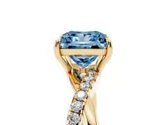 Fancy Blue Princess Cut Diamond Twisted Pavé Band Ring Set in Yellow gold with Prong Setting