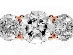 Round Cut Diamond Three-Stone Ring Set in Rose gold with Prong Setting and Plain Band
