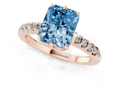 Fancy Blue Radiant Cut Diamond Solitaire Engagement Ring Set in Rose gold with Pavé Band and Prong Setting