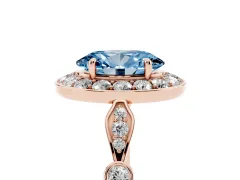 Fancy Blue Oval Cut Diamond Halo Engagement Ring Set in Rose gold with Twisted Band and Prong Setting