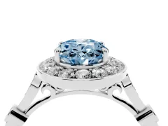 Fancy Blue Oval Cut Diamond Halo Engagement Ring Set in Silver with Twisted Band and Prong Setting
