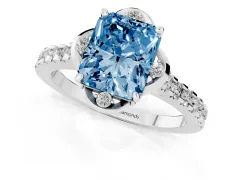 Fancy Blue Radiant Cut Diamond Solitaire Ring Set in White gold with Pavé Band and Floral Prong Setting