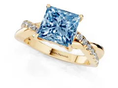 Fancy Blue Princess Cut Diamond Twisted Pavé Band Ring Set in Yellow gold with Prong Setting
