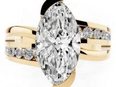 Marquise Cut Diamond Solitaire Ring Set in Yellow gold with Channel Set Split Shank and Tension Prongs