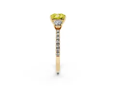 Fancy Yellow Cushion Cut Diamond Three-Stone Ring Set in Yellow gold with Pavé Band and Graduated Sides
