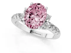 Fancy Pink Oval Cut Diamond Three-Stone Pavé Ring Set in Platinum with Prong Setting