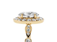 Oval Cut Diamond Halo Engagement Ring Set in Yellow gold with Twisted Band and Prong Setting