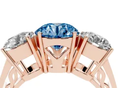 Fancy Blue Round Cut Diamond Three-Stone Ring Set in Rose gold with Textured Band