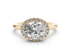Oval Cut Diamond Halo Engagement Ring Set in Yellow gold with Pavé Band and Rising Shoulders