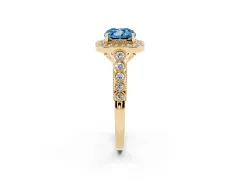 Fancy Blue Cushion Cut Diamond Milgrain Halo Solitaire Ring Set in Yellow gold with Bezel Set Side Stones and Pavé Band