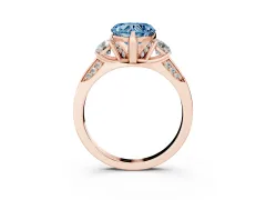 Fancy Blue Heart Cut Diamond Three-Stone Ring Set in Rose gold with Pavé Band and Smaller Side Stones